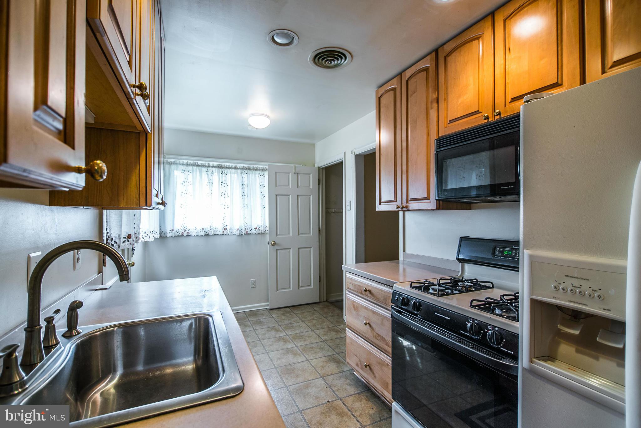 508 Orrin Street Southeast Vienna, VA 22180 - Photo 3 of 30 a kitchen with granite countertop a stove and a sink