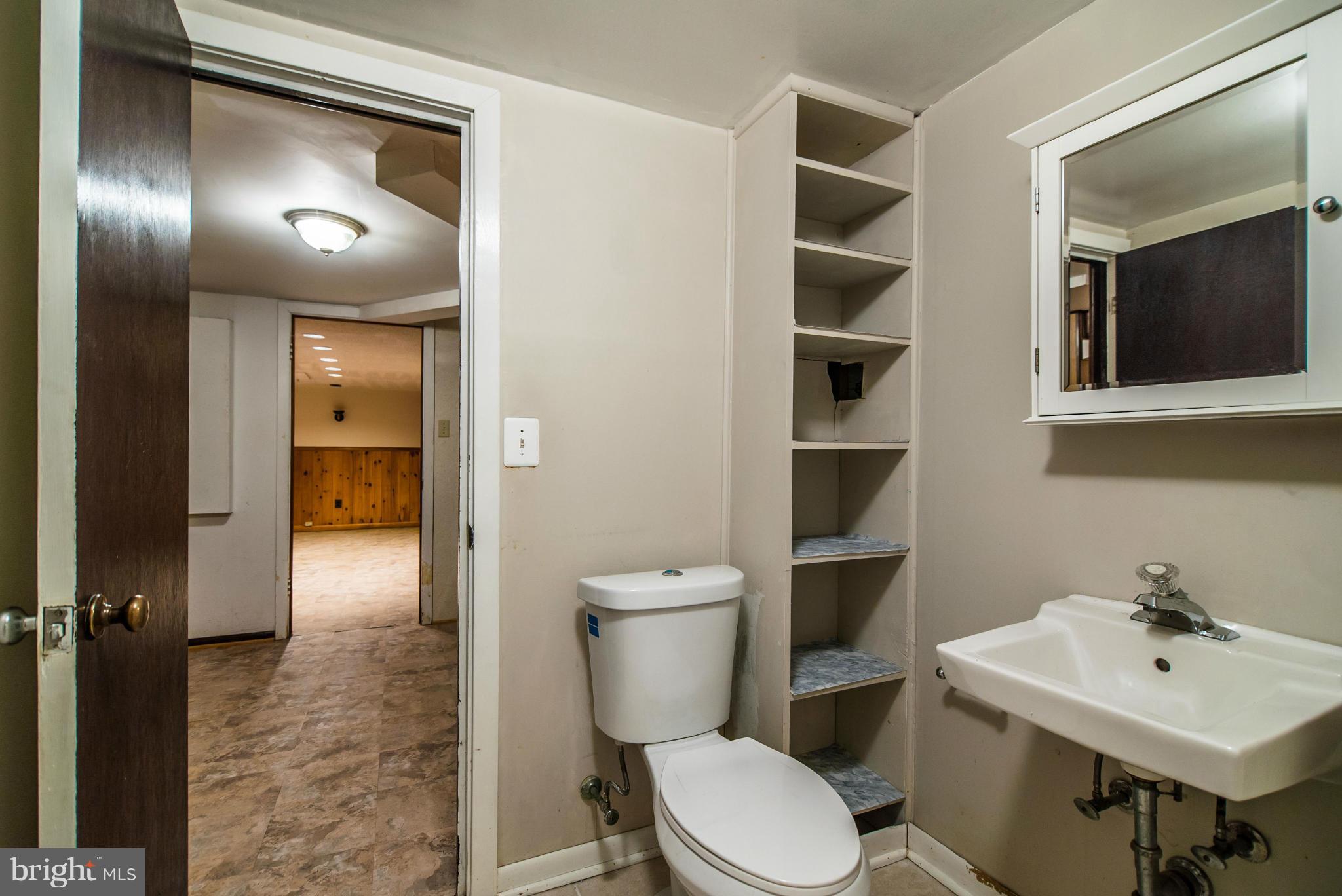 508 Orrin Street Southeast Vienna, VA 22180 - Photo 25 of 30 a bathroom with a toilet a sink and mirror