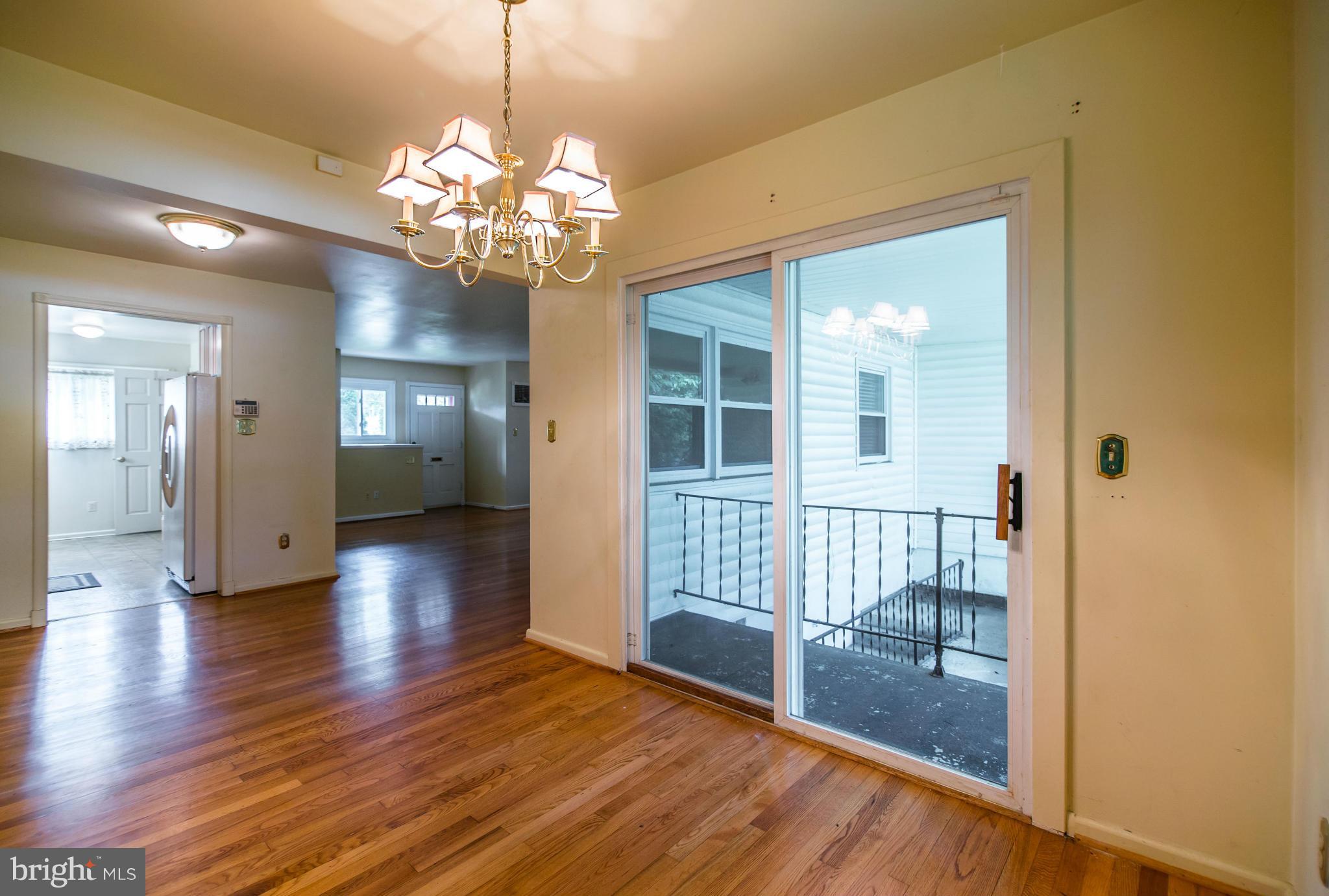 508 Orrin Street Southeast Vienna, VA 22180 - Photo 5 of 30 a view of a hallway with wooden floor and a large mirror