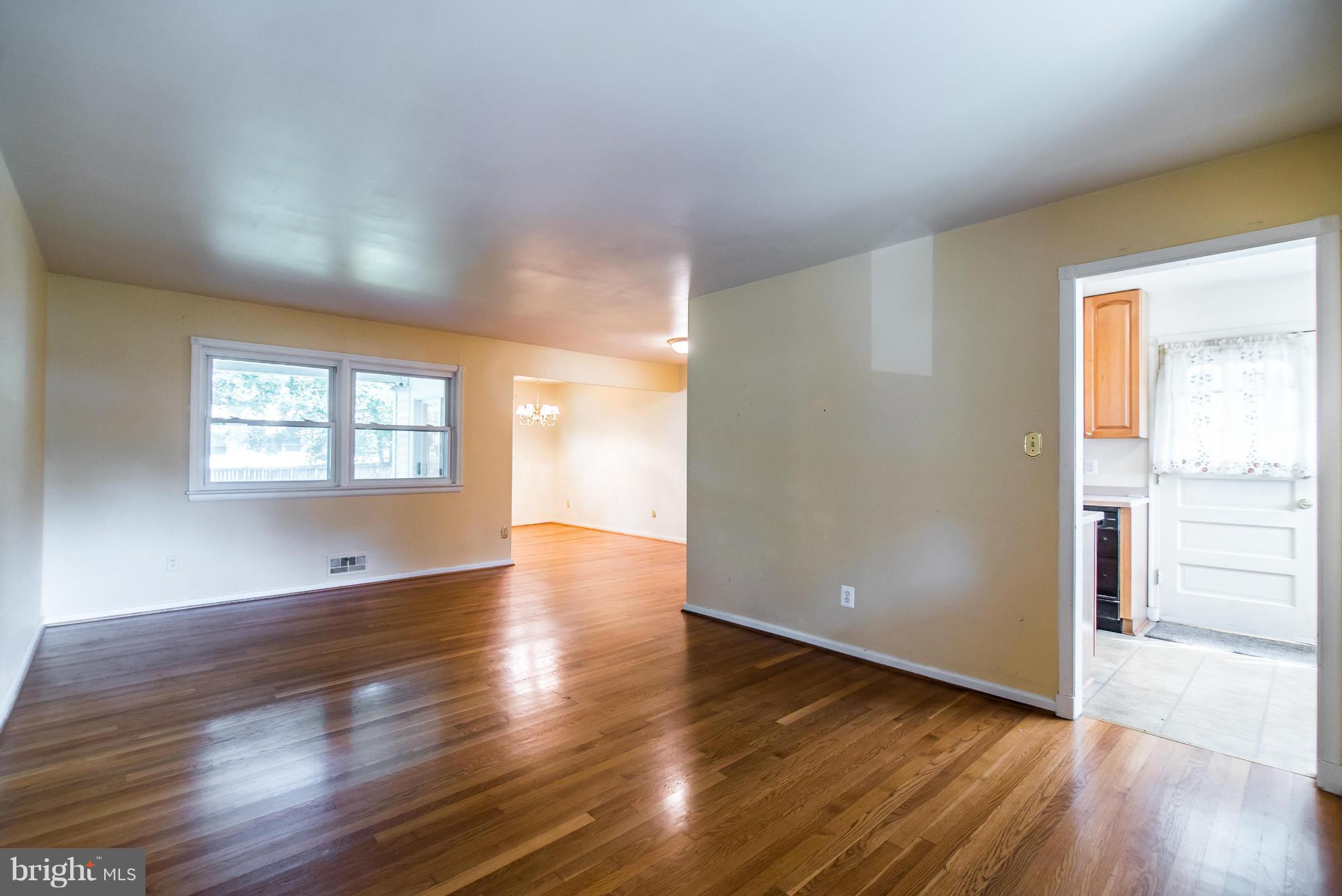 508 Orrin Street Southeast Vienna, VA 22180 - Photo 7 of 30 an empty room with wooden floor and windows