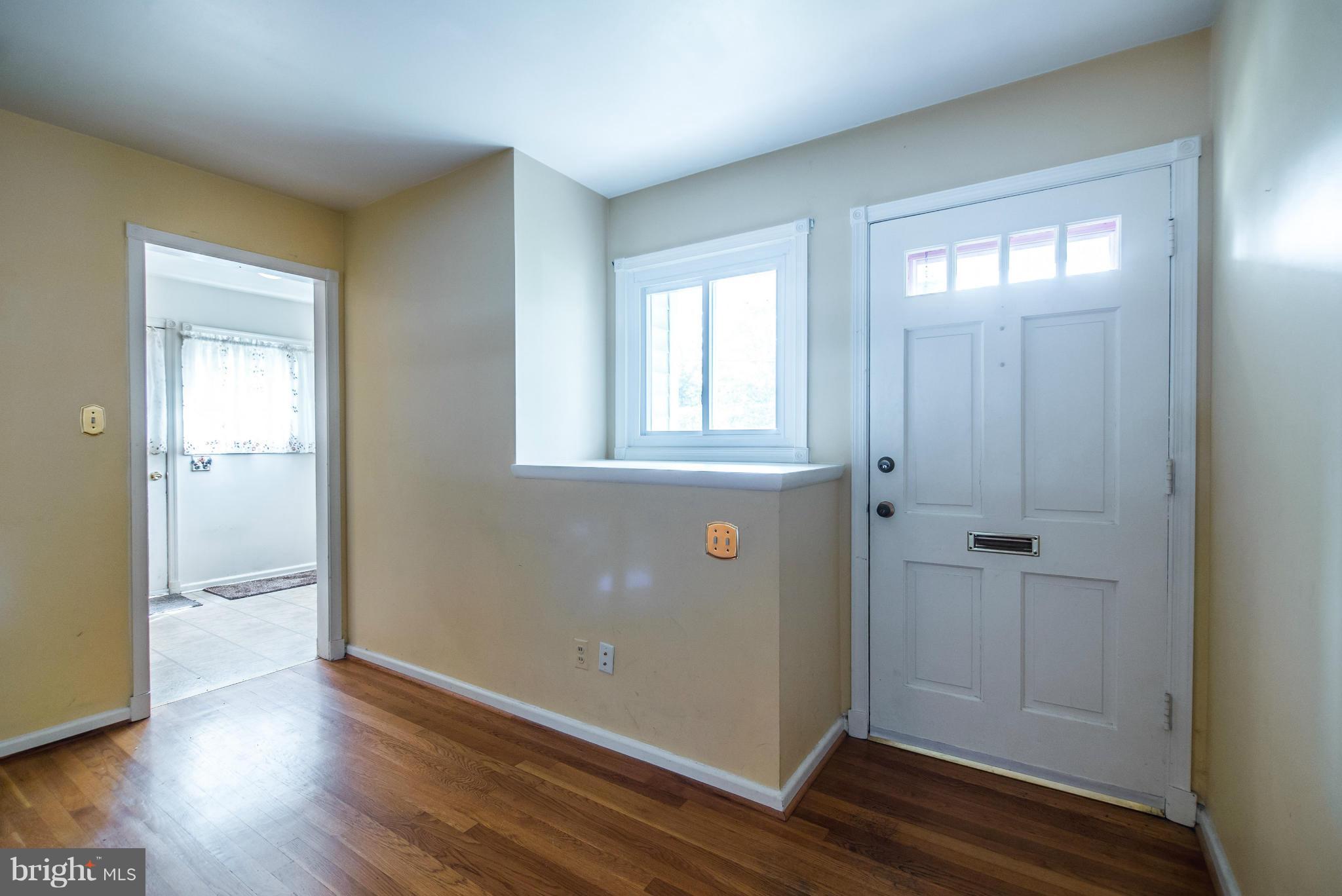 508 Orrin Street Southeast Vienna, VA 22180 - Photo 8 of 30 an empty room with wooden floor and windows