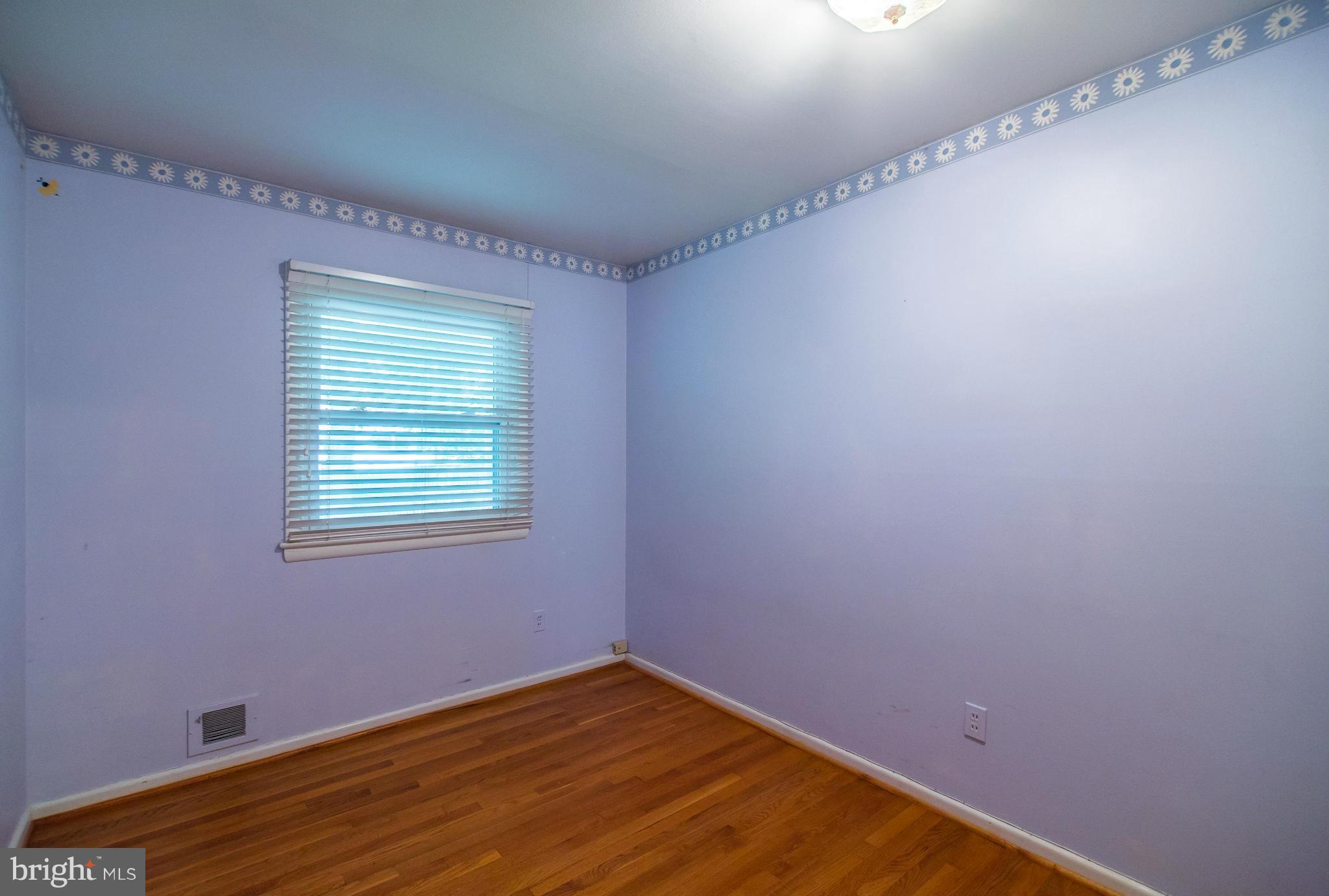 508 Orrin Street Southeast Vienna, VA 22180 - Photo 9 of 30 a view of an empty room with wooden floor and a window