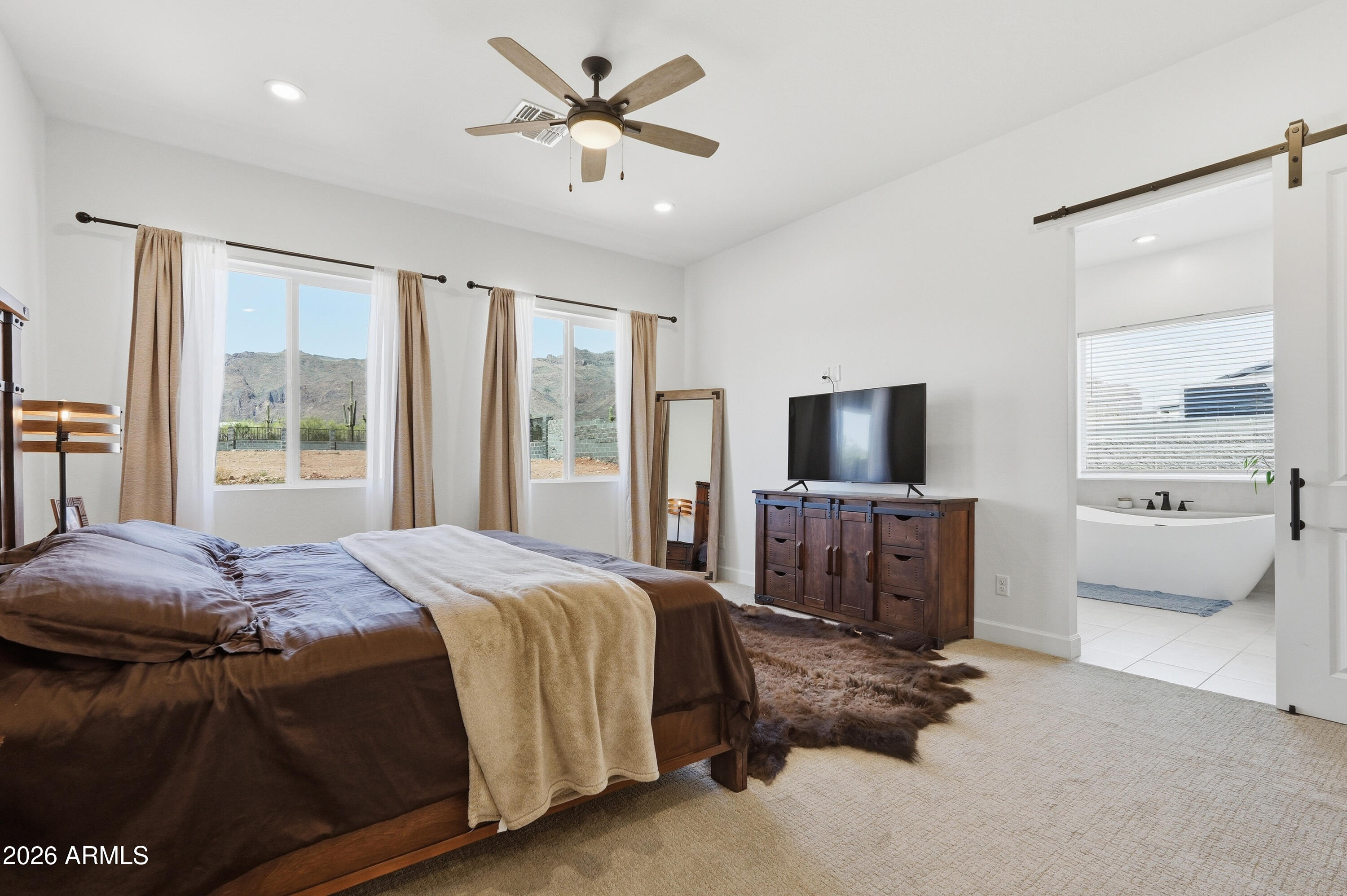 10464 East Magnolia Road Gold Canyon, AZ 85118 - Photo 23 of 77 a bedroom with a bed and a television