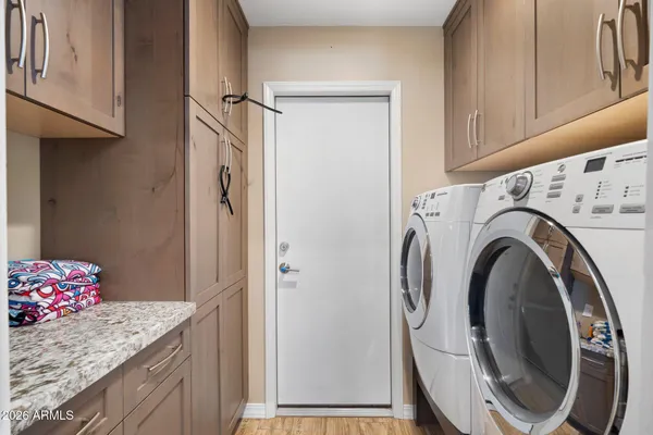 a view of bathroom with washer and dryer