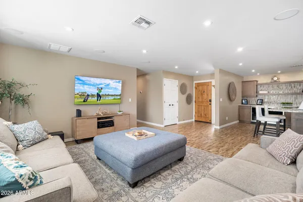 a living room with furniture and a flat screen tv