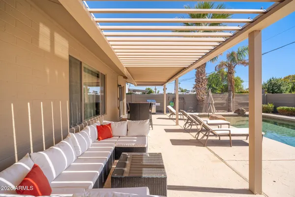 a living room with furniture and a large window