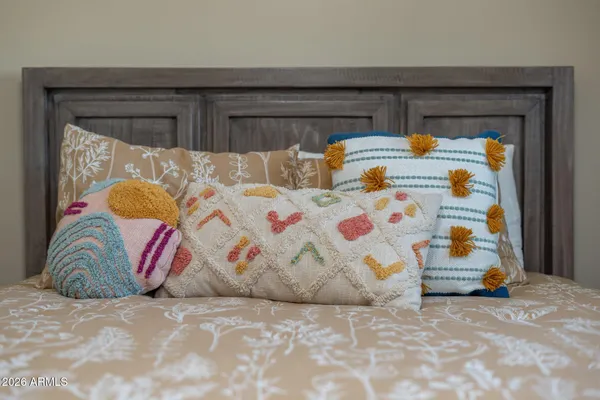 a bedroom with bed and a window