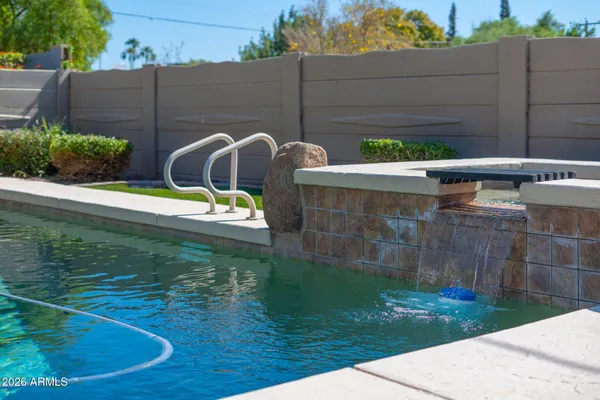 a view of a backyard with sitting area