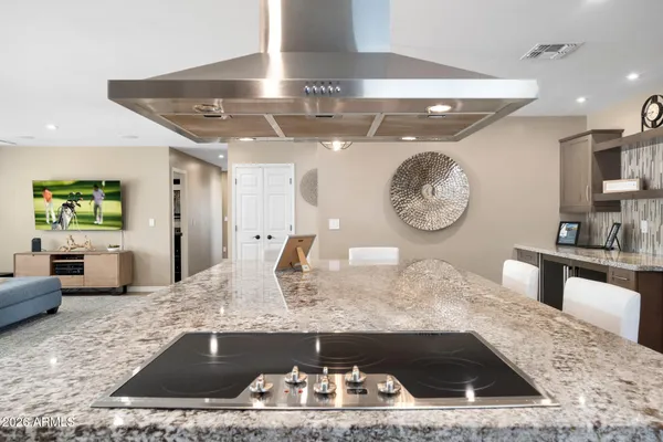 a living room with couch and a clock