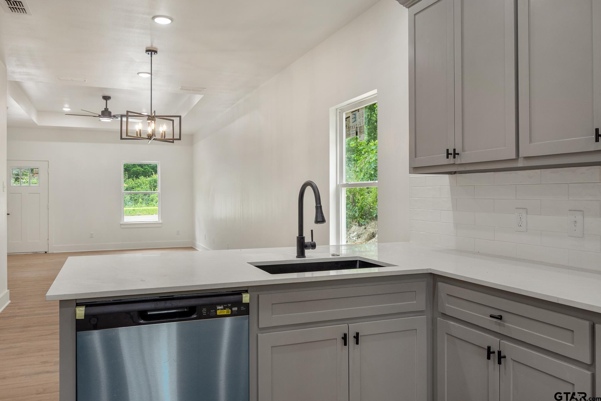 726 Boyd Avenue Tyler, TX 75701 - Photo 14 of 28 a kitchen with a sink and a window