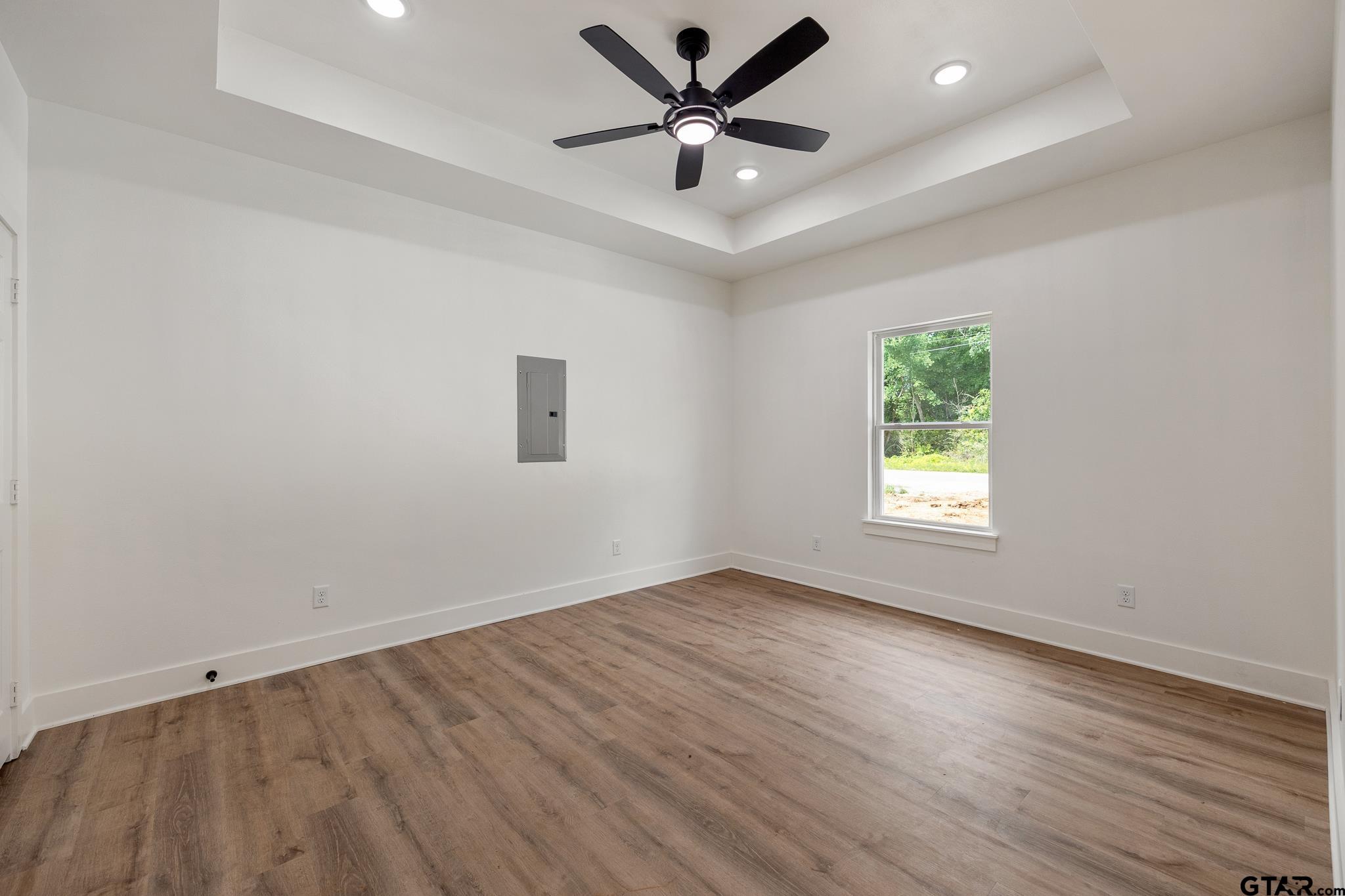 726 Boyd Avenue Tyler, TX 75701 - Photo 17 of 28 wooden floor in an empty room with a window