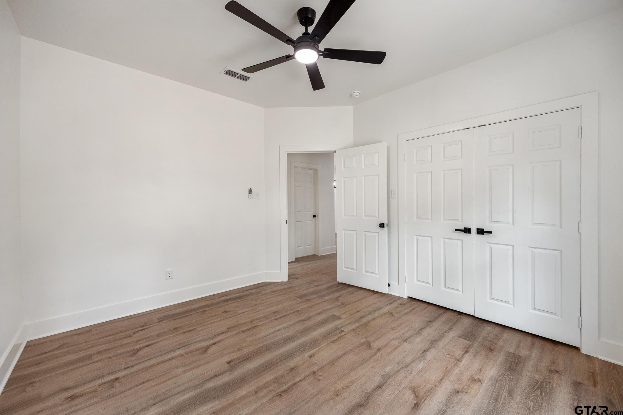 726 Boyd Avenue Tyler, TX 75701 - Photo 22 of 28 wooden floor in an empty room