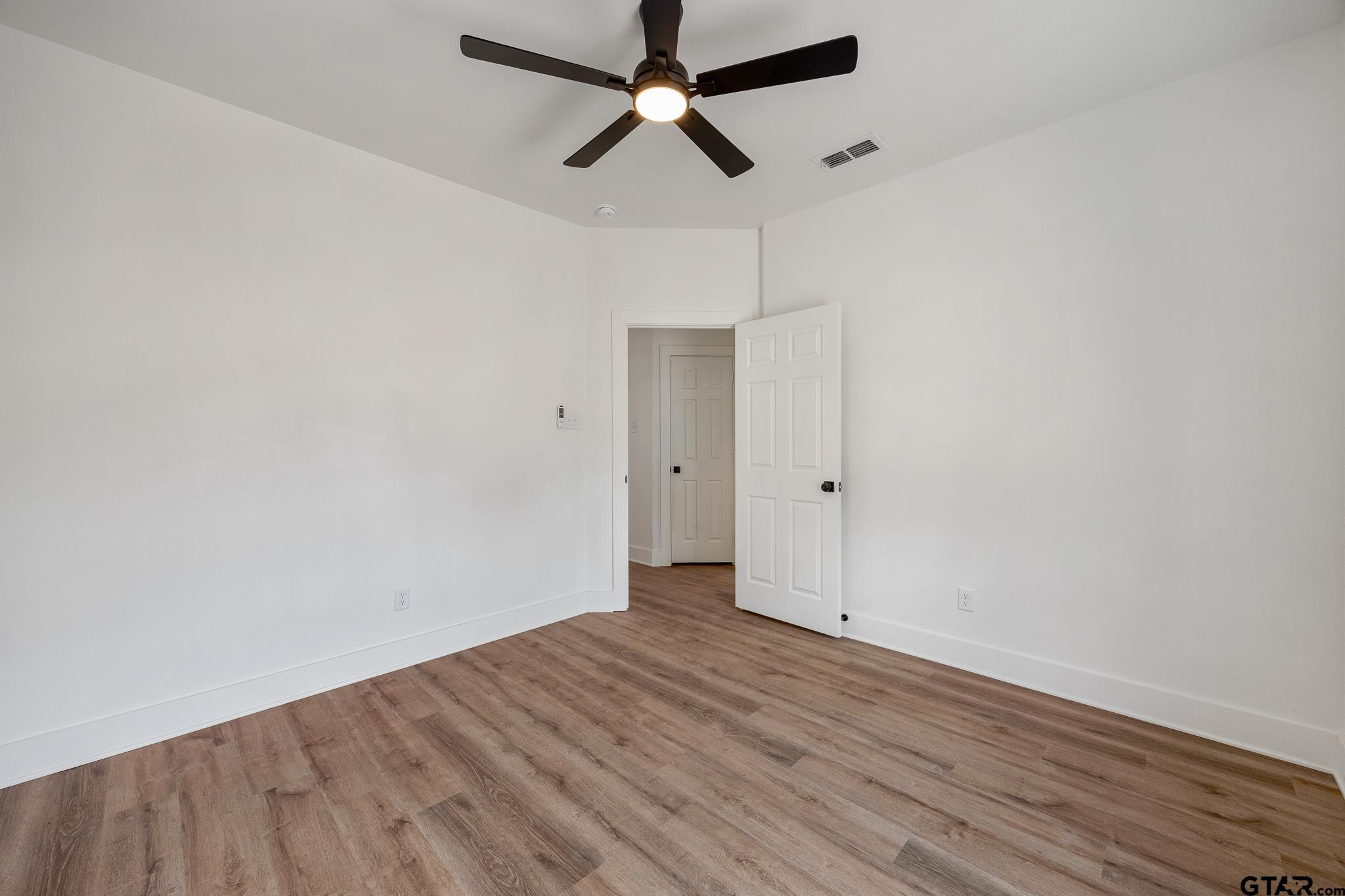726 Boyd Avenue Tyler, TX 75701 - Photo 24 of 28 wooden floor in an empty room