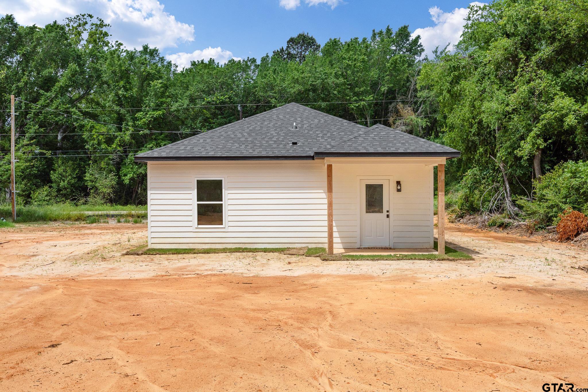 726 Boyd Avenue Tyler, TX 75701 - Photo 26 of 28 a house with trees in the background