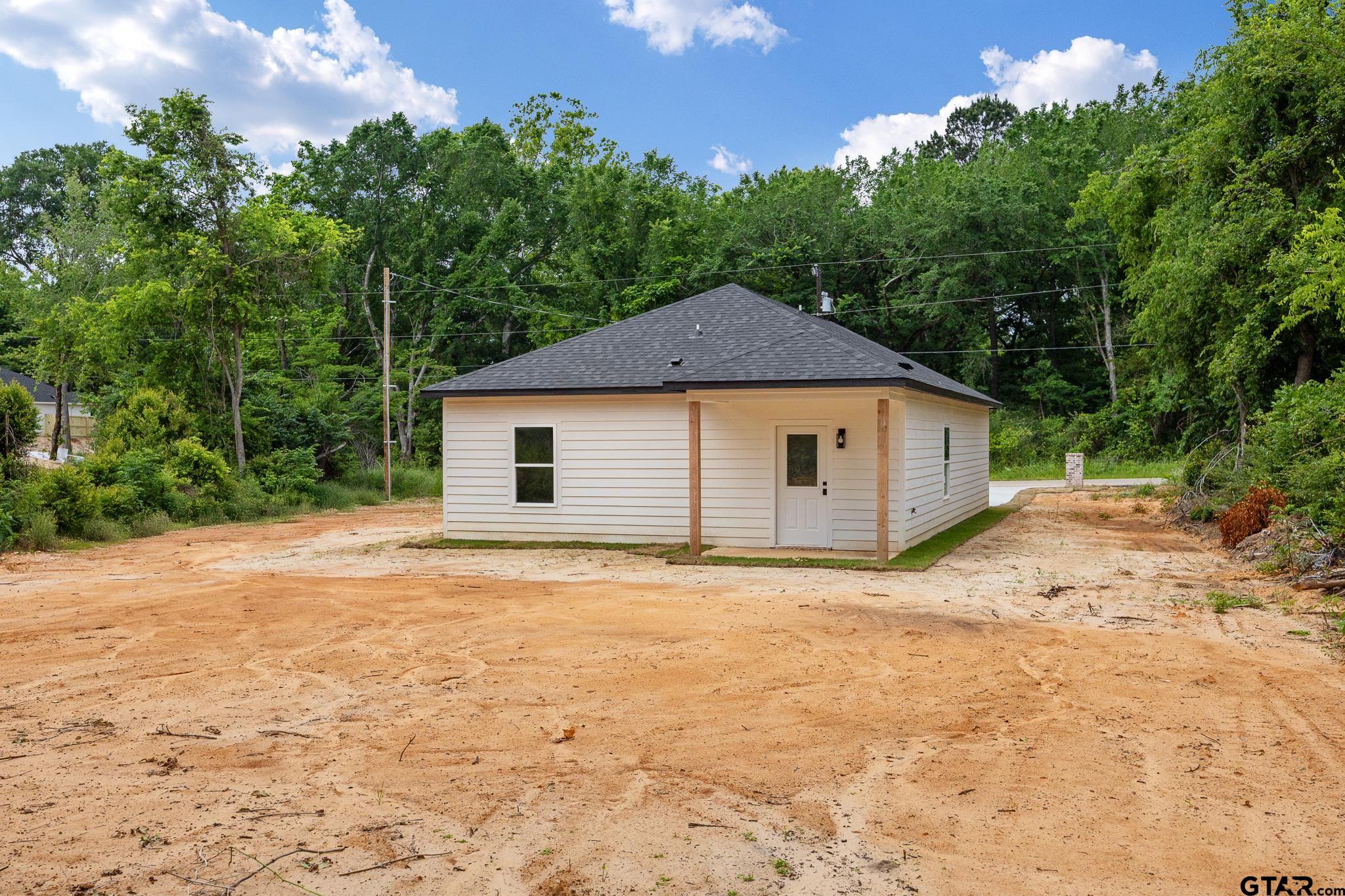 726 Boyd Avenue Tyler, TX 75701 - Photo 27 of 28 a house with trees in the background