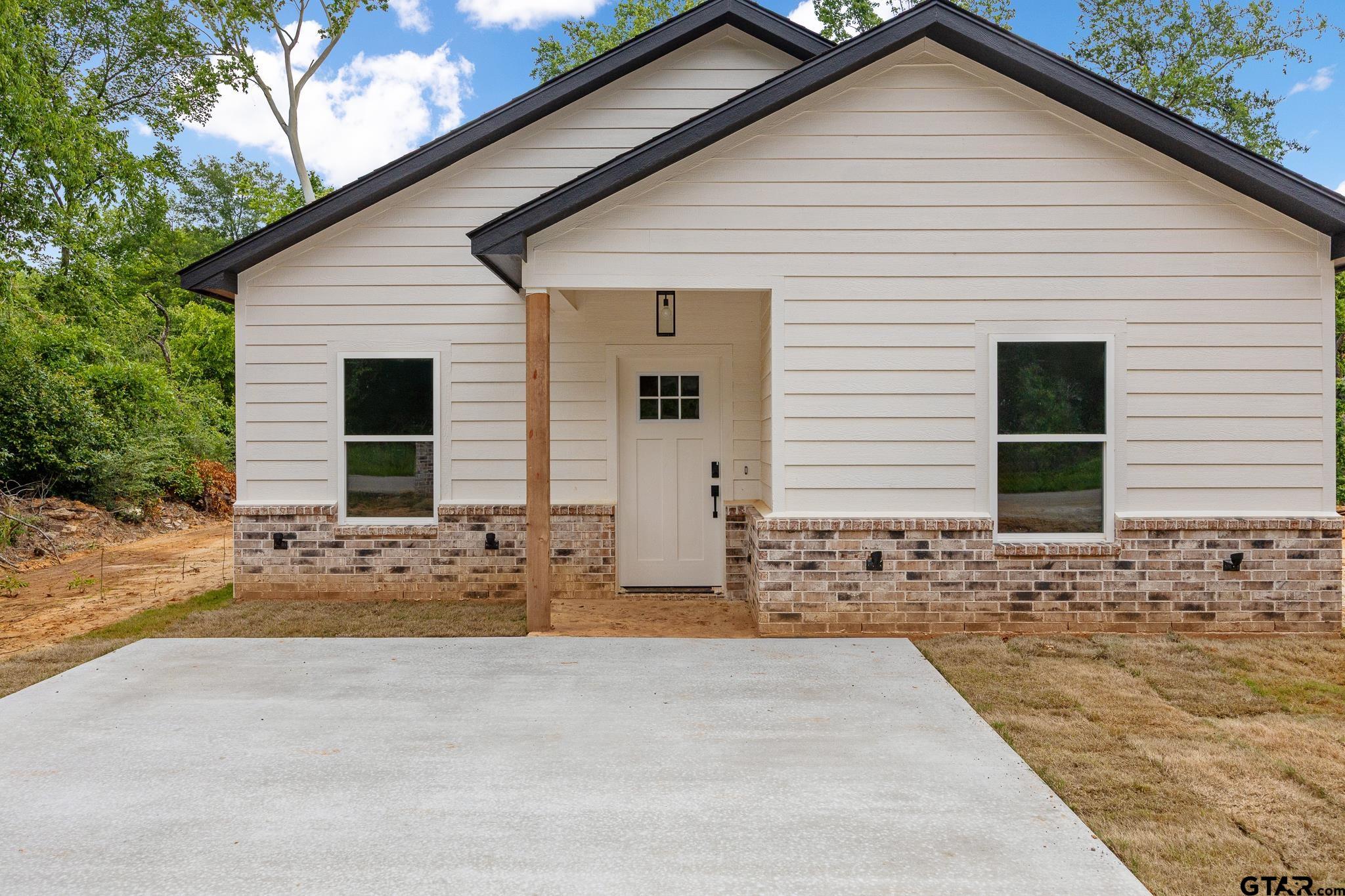 726 Boyd Avenue Tyler, TX 75701 - Photo 3 of 28 a view of a house with wooden fence