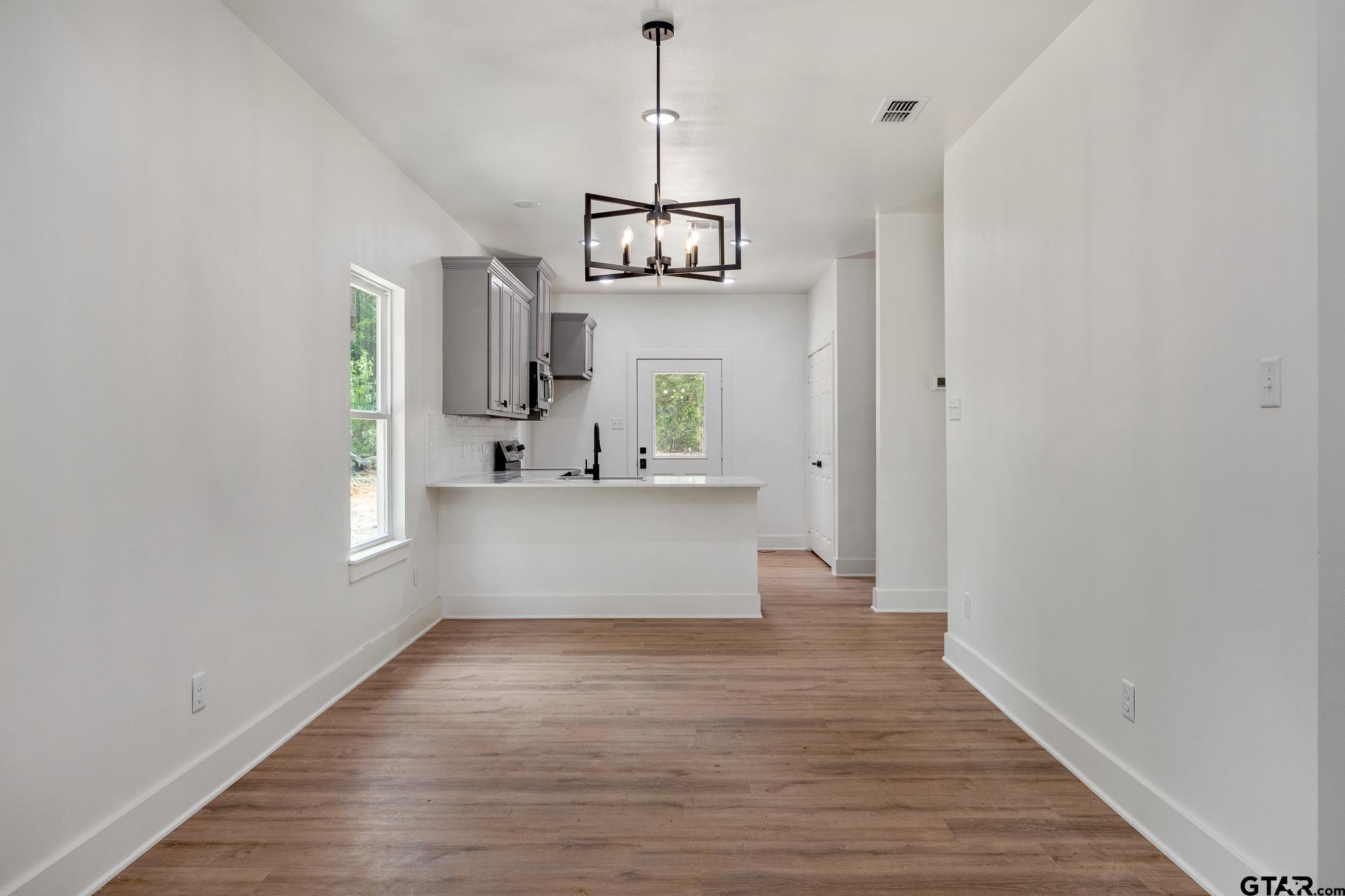 726 Boyd Avenue Tyler, TX 75701 - Photo 8 of 28 a view of a kitchen from the hallway