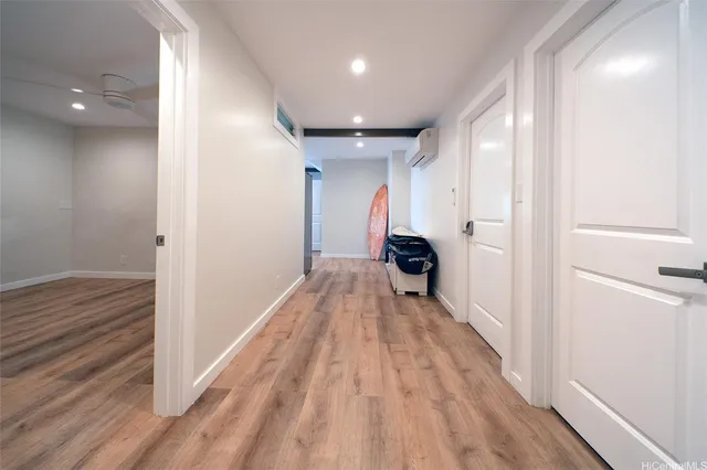 a view of hallway with wooden floor