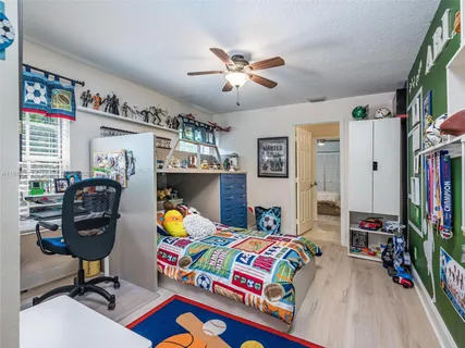 a living room with furniture and a gym equipment
