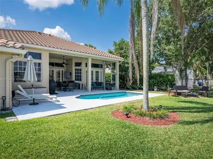 a swimming pool with porch and patio