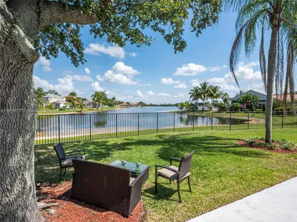 a view of a garden with a lake view
