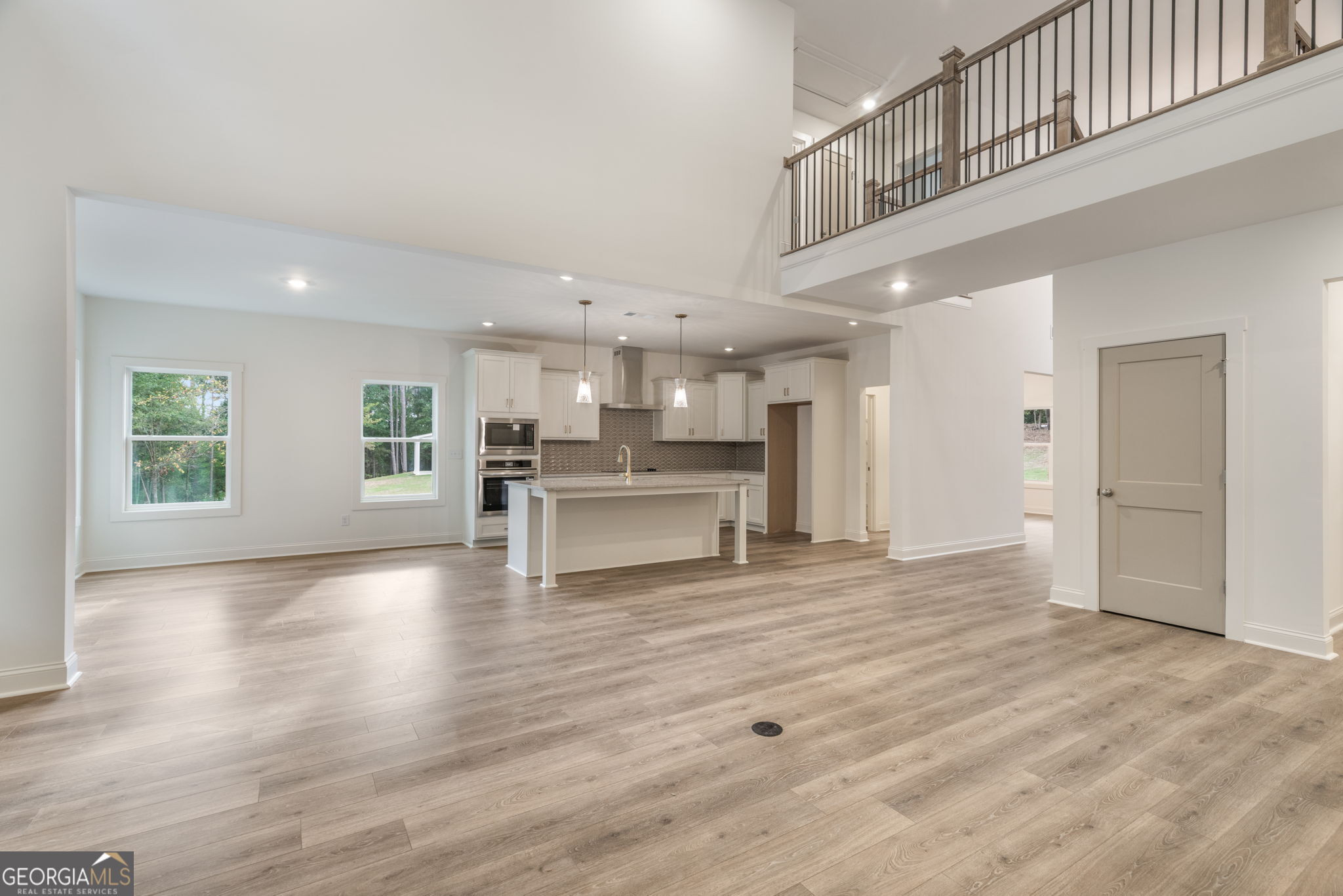 106 Mill Race Road Thomaston, GA 30286 - Photo 13 of 63 a view of kitchen with kitchen island wooden floor center island and stainless steel appliances