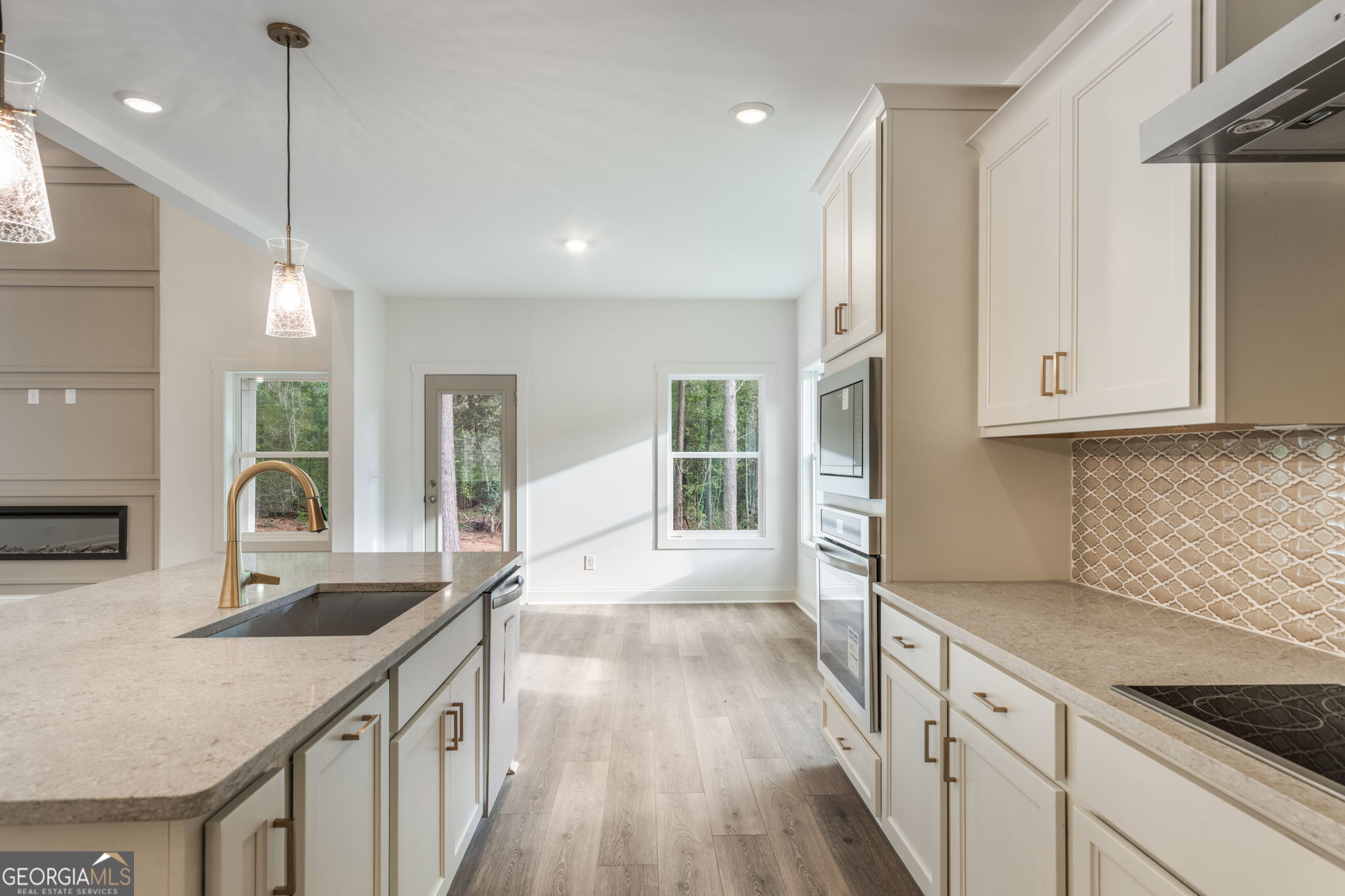 106 Mill Race Road Thomaston, GA 30286 - Photo 20 of 63 a kitchen with granite countertop a sink a counter space appliances and cabinets