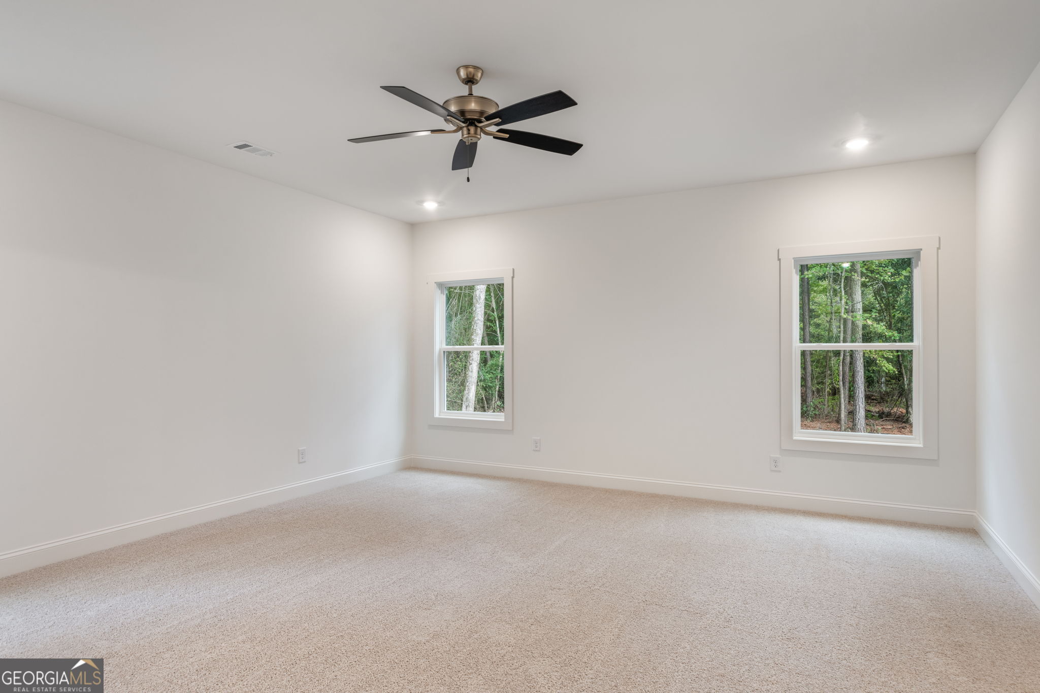 106 Mill Race Road Thomaston, GA 30286 - Photo 22 of 63 an empty room with a window and a fan