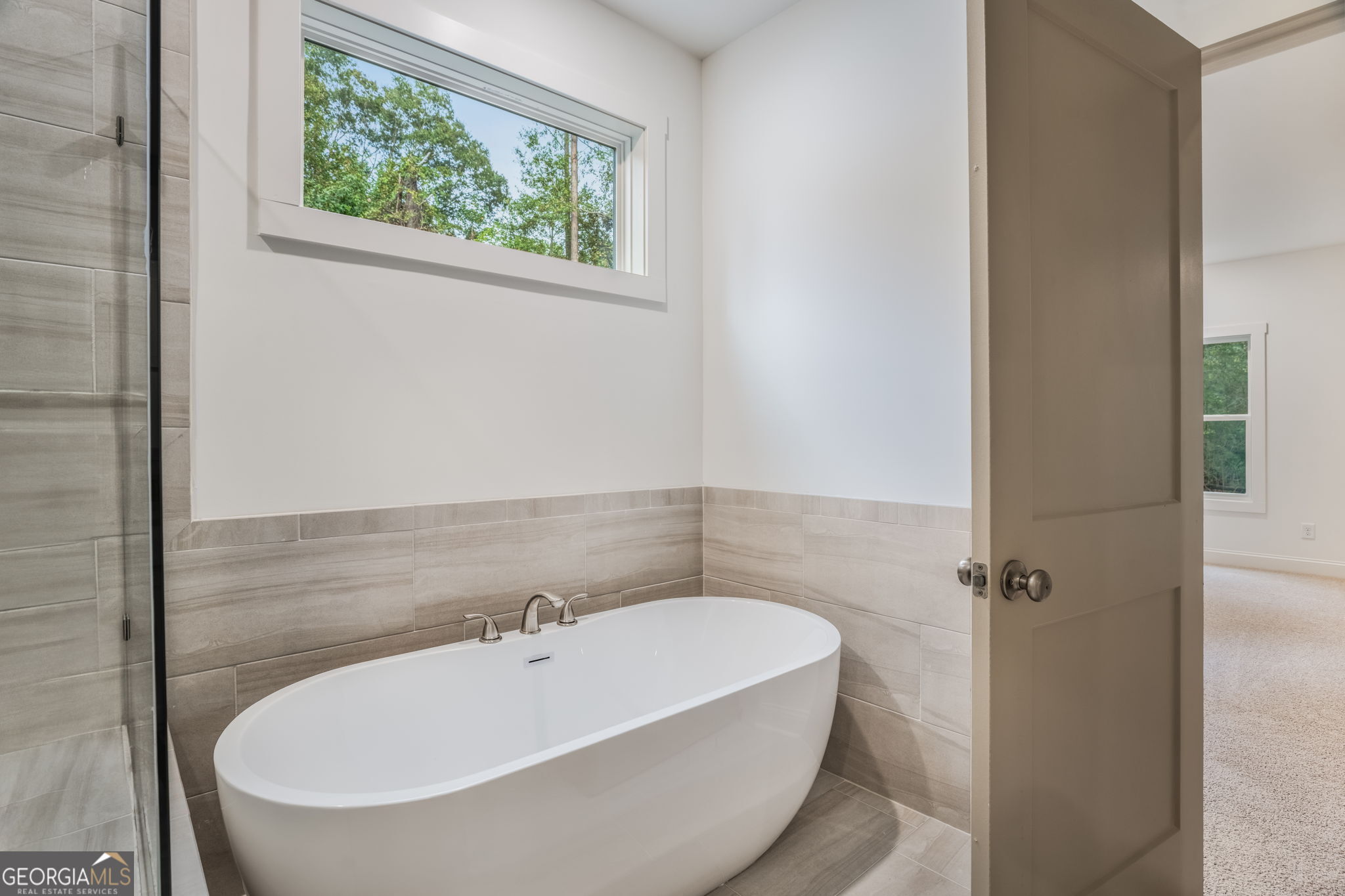 106 Mill Race Road Thomaston, GA 30286 - Photo 26 of 63 a bathroom with a bathtub
