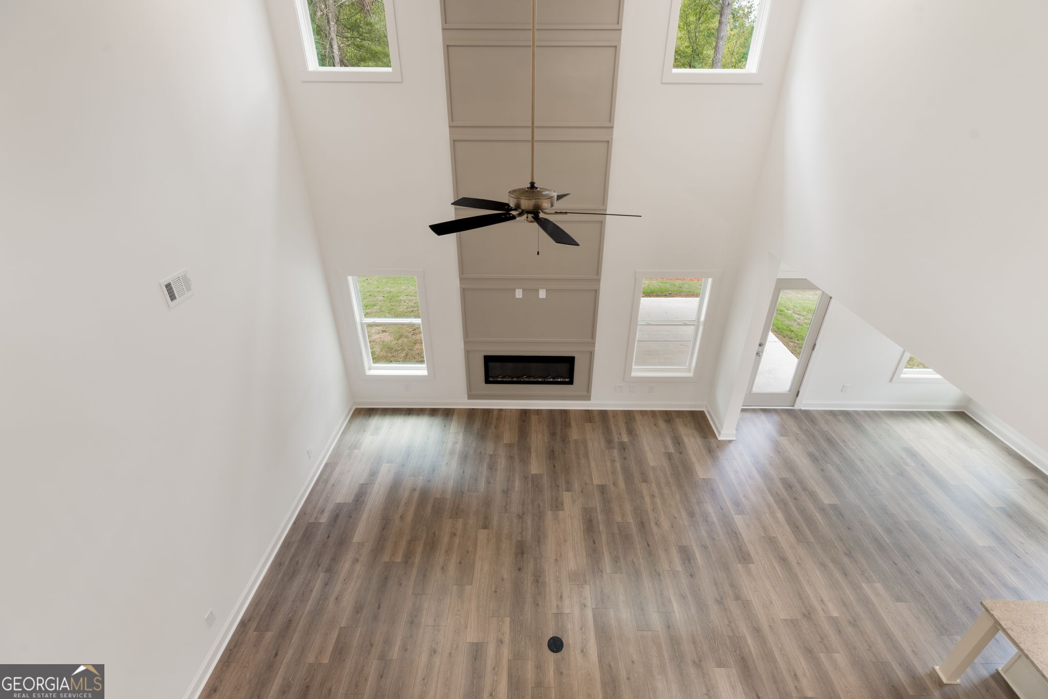106 Mill Race Road Thomaston, GA 30286 - Photo 38 of 63 a view of empty room with wooden floor and fireplace