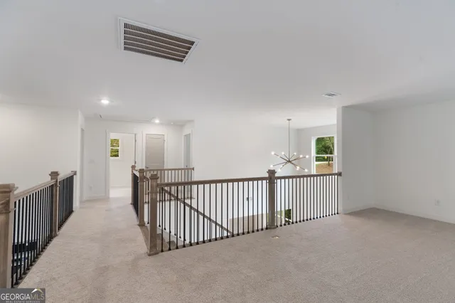a bathroom with a toilet a sink a vanity and mirror
