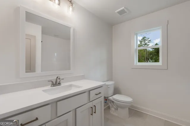 a house that has a tree in front of it