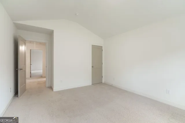 an aerial view of a house with outdoor space