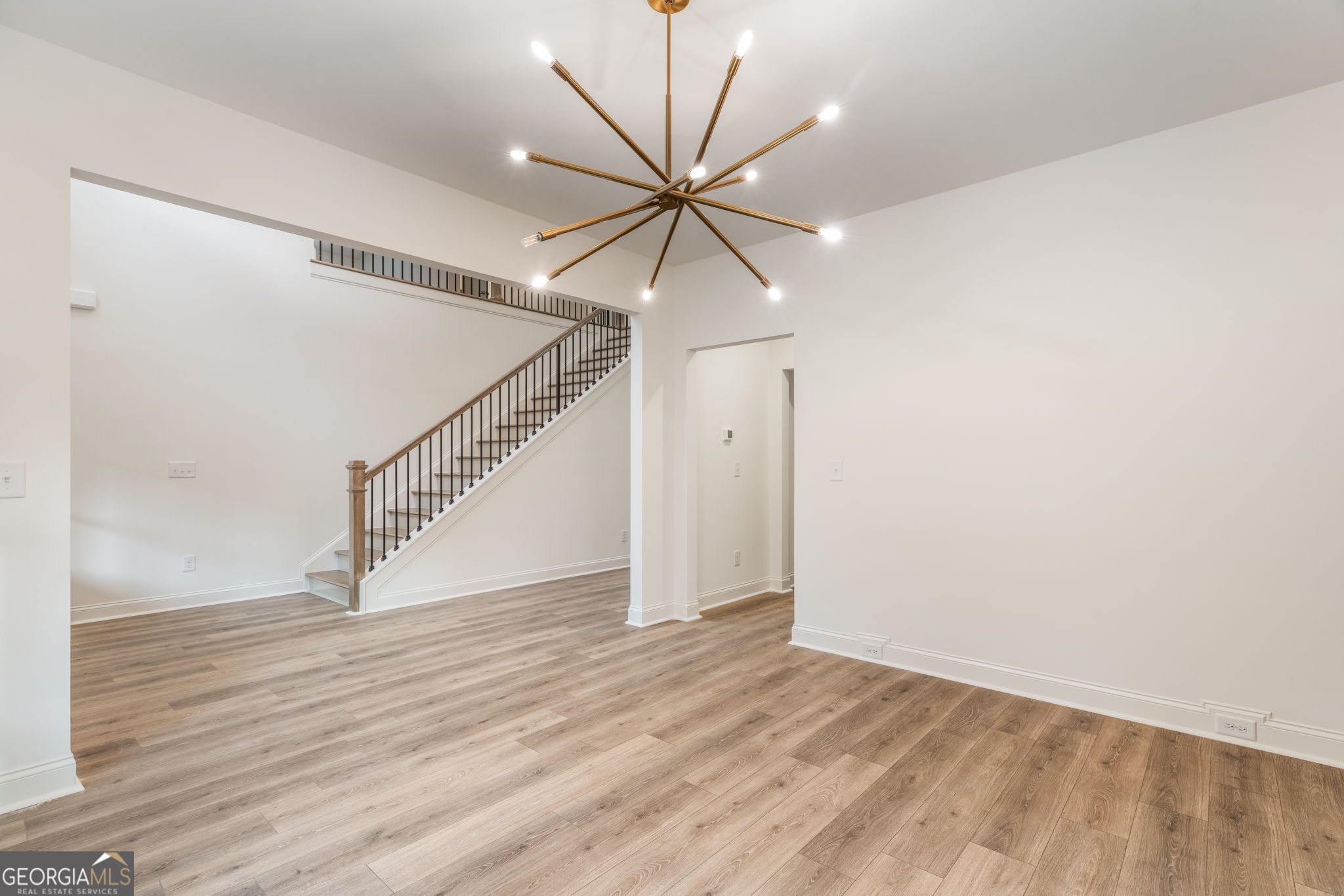 106 Mill Race Road Thomaston, GA 30286 - Photo 5 of 63 a view of a hallway with a ceiling fan and wooden floor