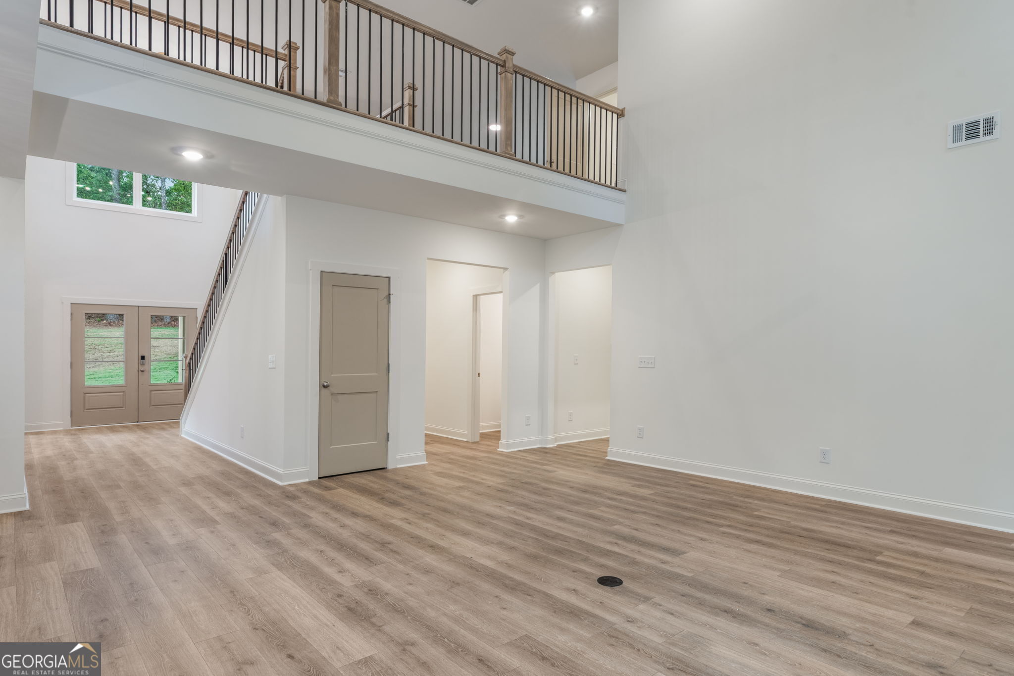 106 Mill Race Road Thomaston, GA 30286 - Photo 7 of 63 an empty room with wooden floor and windows