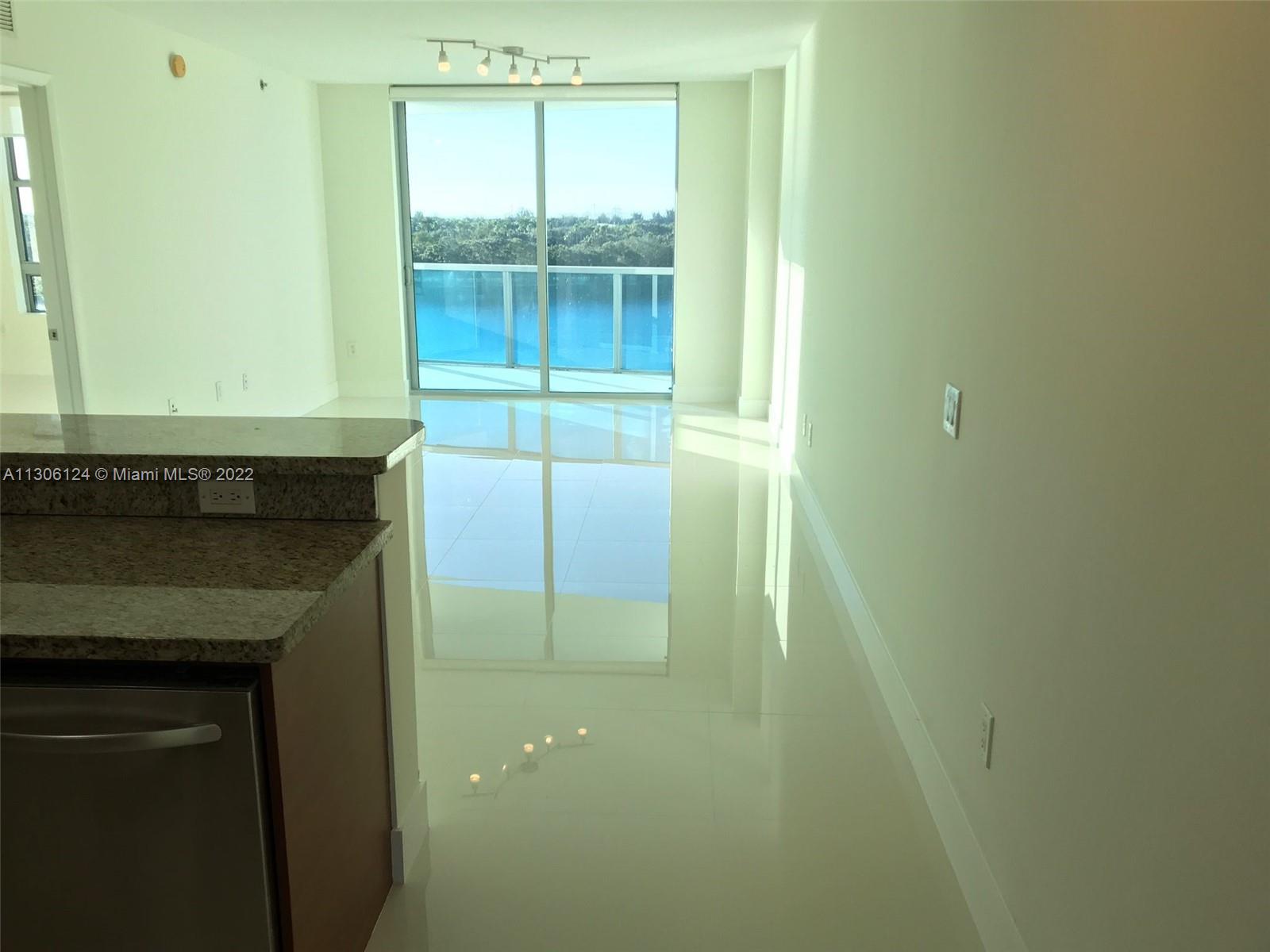 2681 North Flamingo Road, Unit 1905S Sunrise, FL 33323 - Photo 16 of 24 a bathroom with a shower and a window