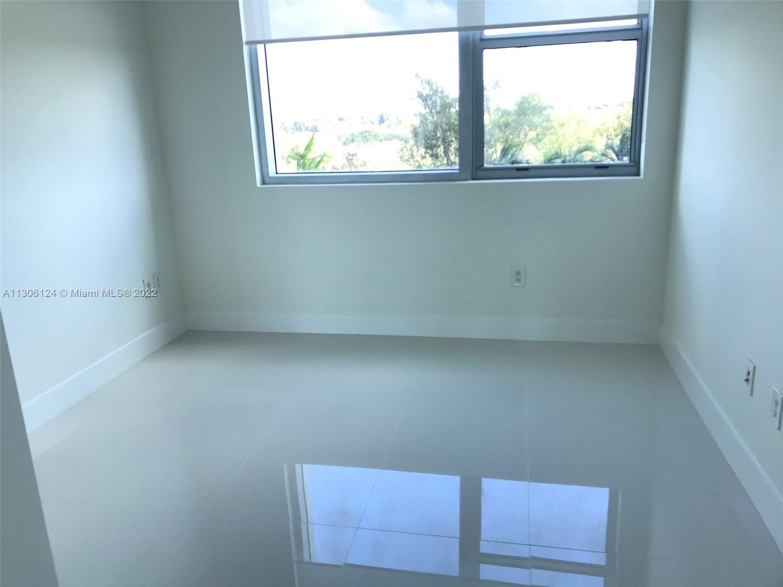 2681 North Flamingo Road, Unit 1905S Sunrise, FL 33323 - Photo 20 of 24 an empty room with a window
