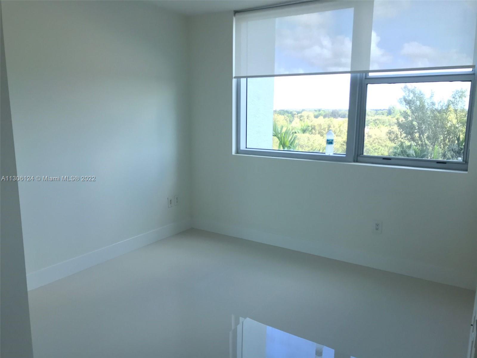 2681 North Flamingo Road, Unit 1905S Sunrise, FL 33323 - Photo 21 of 24 an empty room with a window