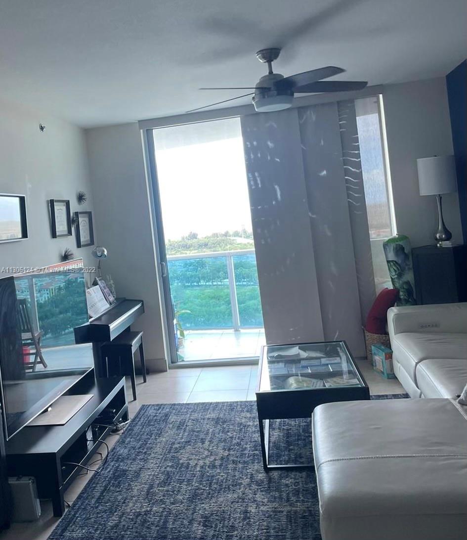 2681 North Flamingo Road, Unit 1905S Sunrise, FL 33323 - Photo 24 of 24 a living room with furniture and a window