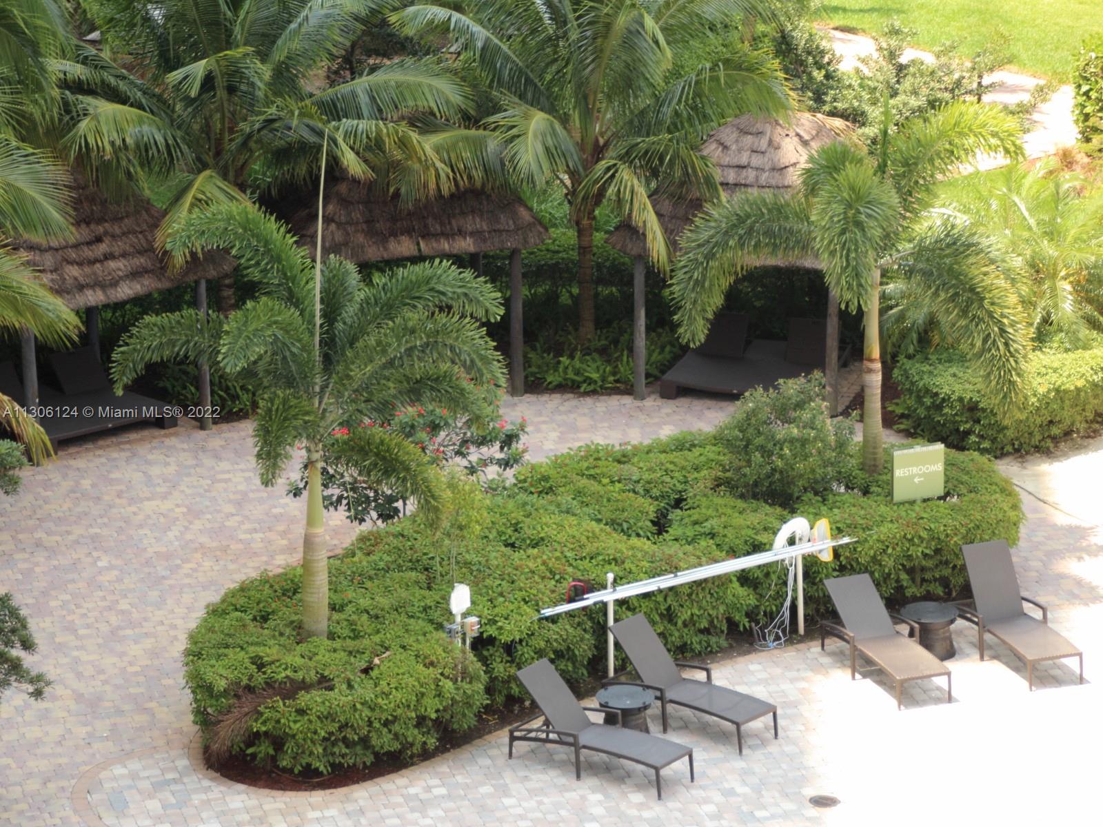 2681 North Flamingo Road, Unit 1905S Sunrise, FL 33323 - Photo 8 of 24 a view of a chair and table in the garden