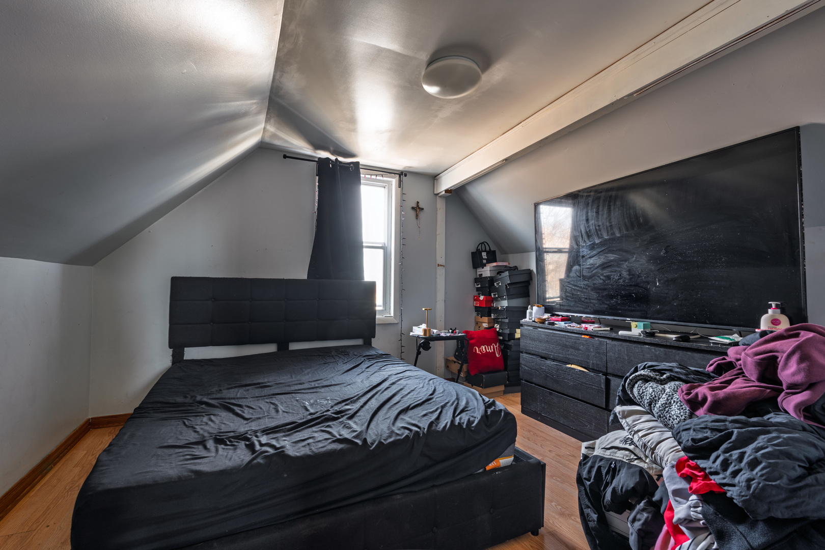 5239 South Troy Street Chicago, IL 60632 - Photo 12 of 21 a bedroom with a bed and a flat screen tv