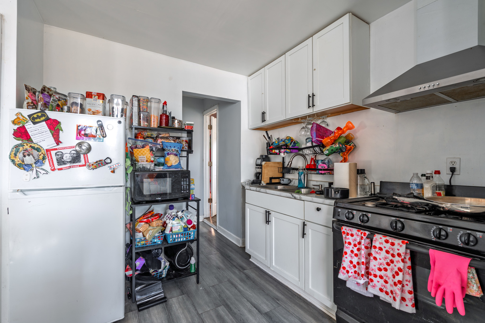 5239 South Troy Street Chicago, IL 60632 - Photo 21 of 21 a kitchen with a refrigerator and a stove top oven