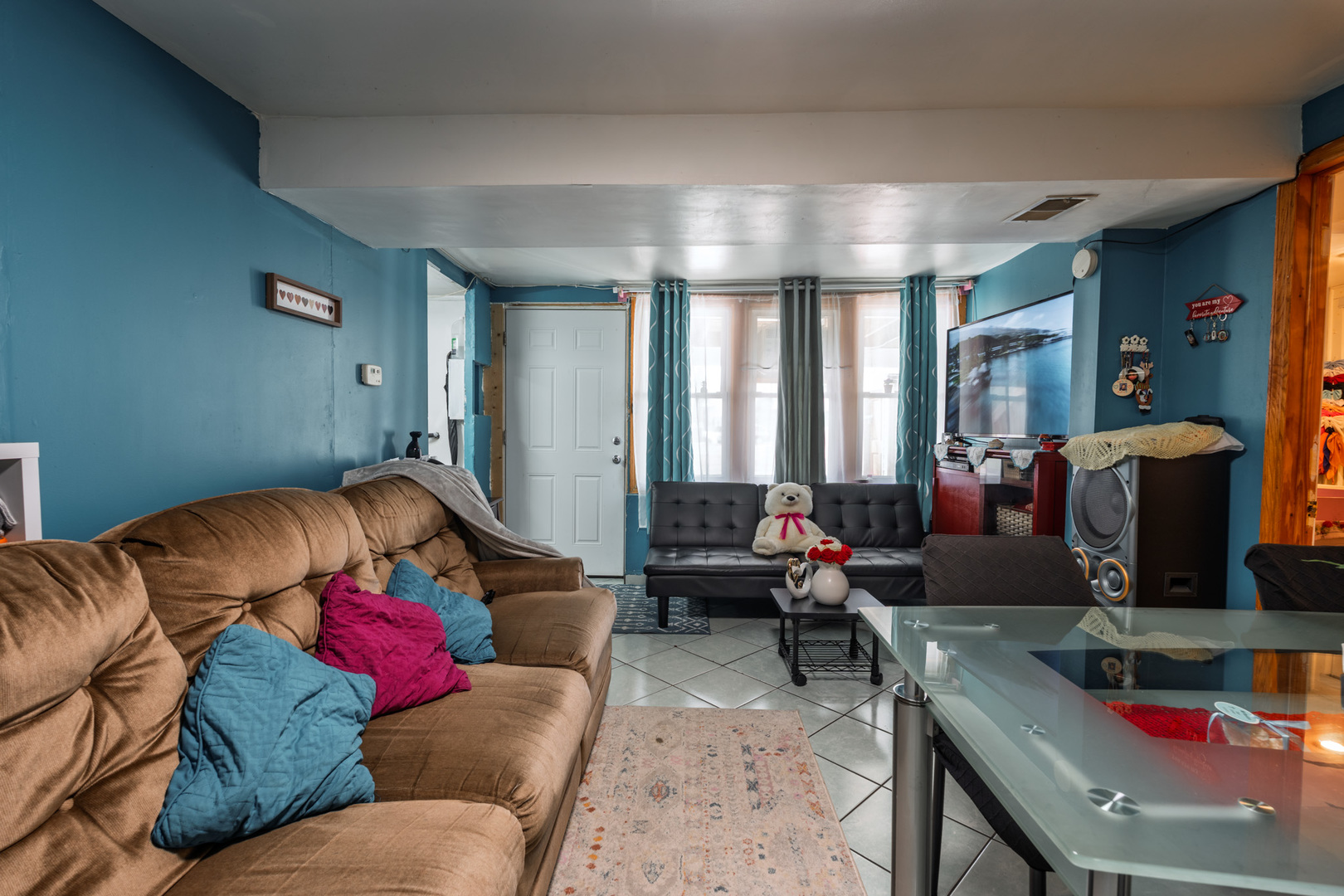 5239 South Troy Street Chicago, IL 60632 - Photo 3 of 21 a living room with furniture and a large window