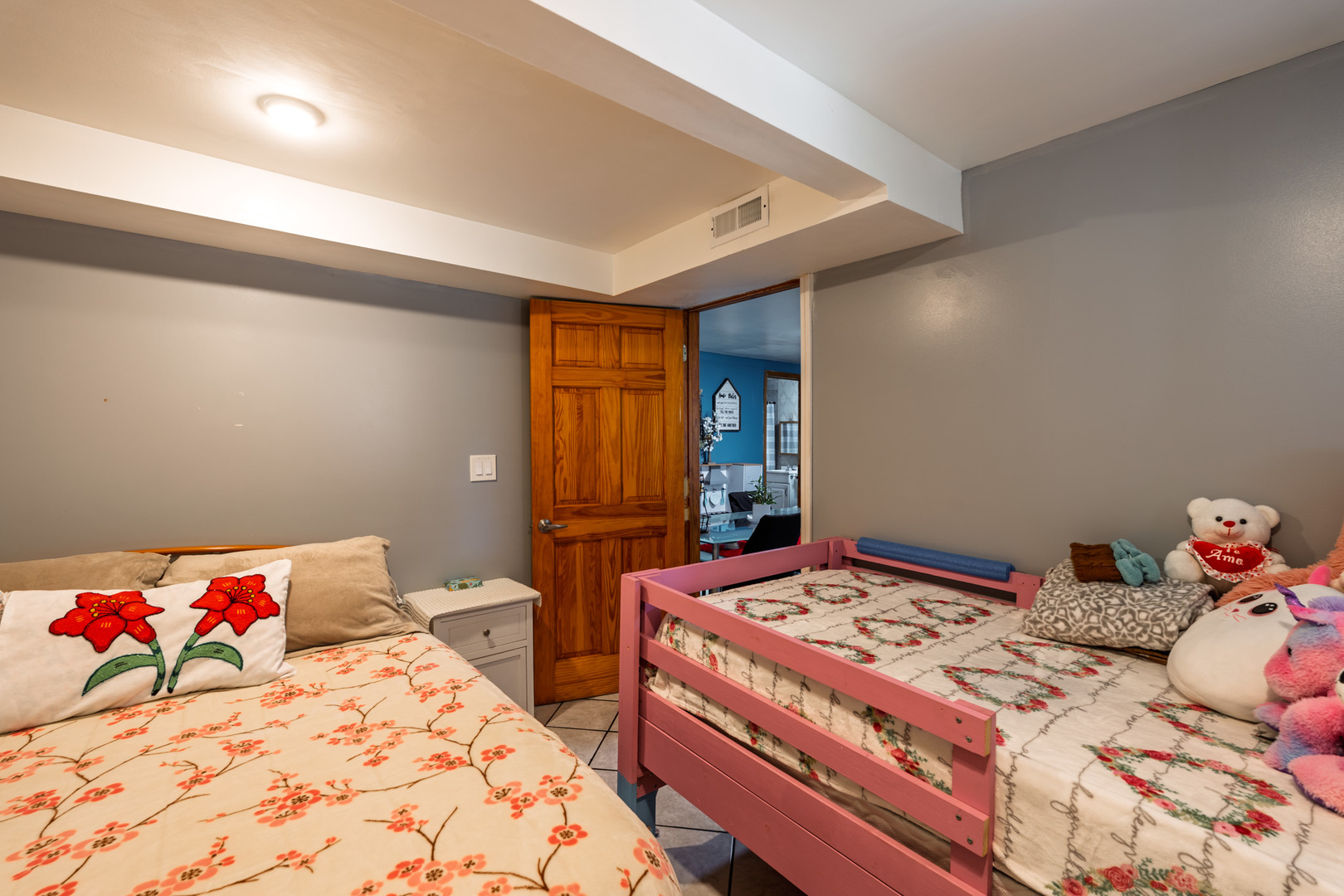 5239 South Troy Street Chicago, IL 60632 - Photo 5 of 21 a bedroom with a bed and a dresser in it
