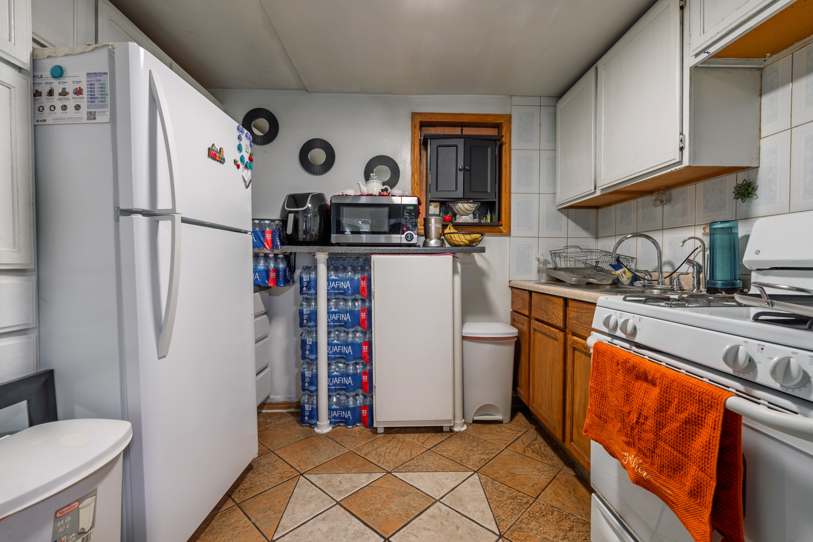 5239 South Troy Street Chicago, IL 60632 - Photo 8 of 21 a kitchen with stainless steel appliances granite countertop a refrigerator and a stove