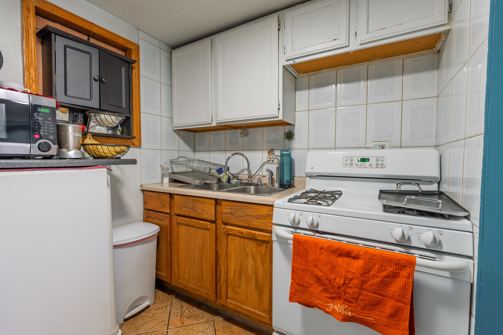 5239 South Troy Street Chicago, IL 60632 - Photo 9 of 21 a kitchen with stainless steel appliances granite countertop a stove a sink and a refrigerator