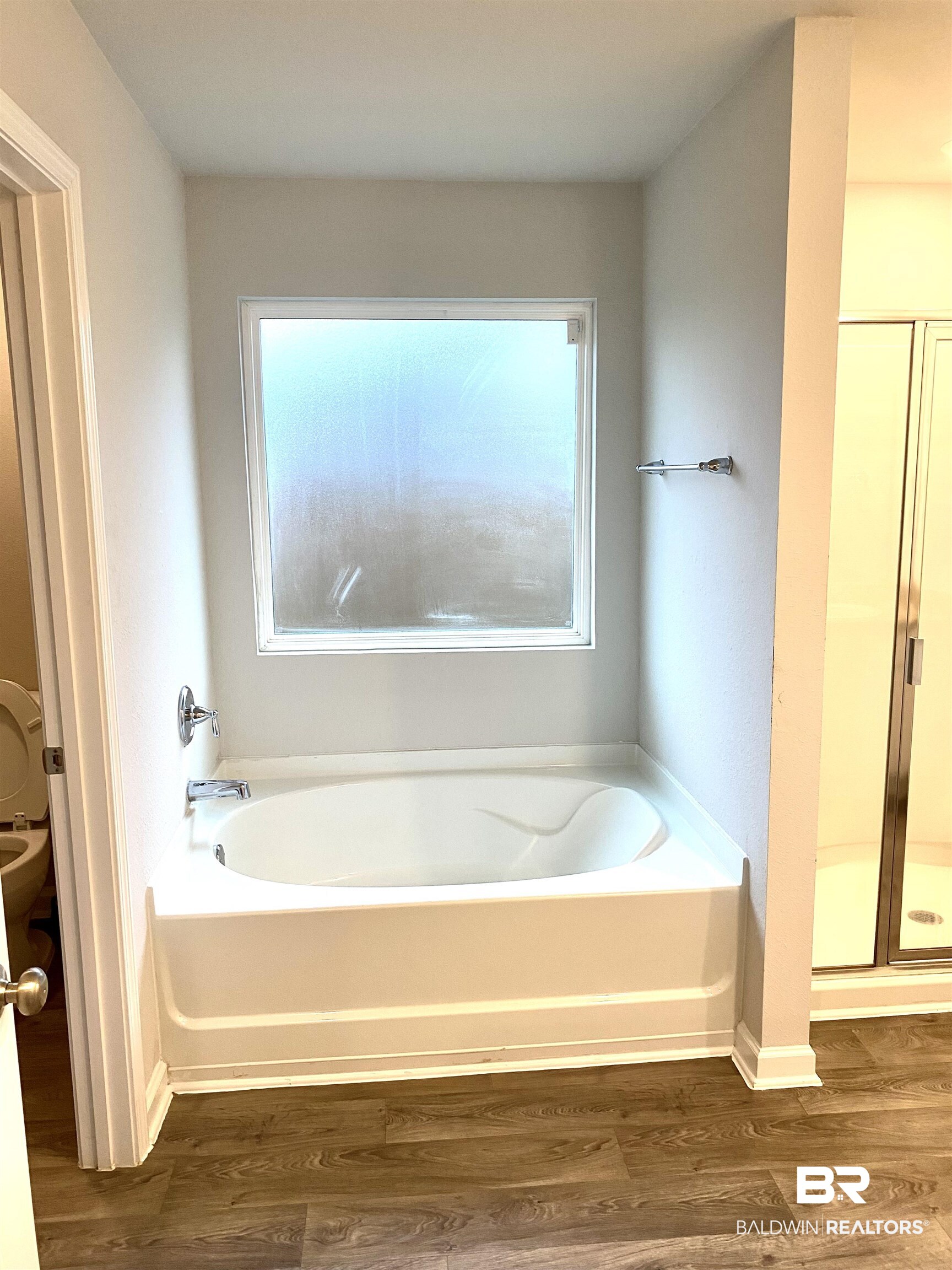 14496 Cavendish Drive Foley, AL 36535 - Photo 20 of 26 Full bathroom featuring healthy amount of natural light, dark wood finished floors, and a stall shower