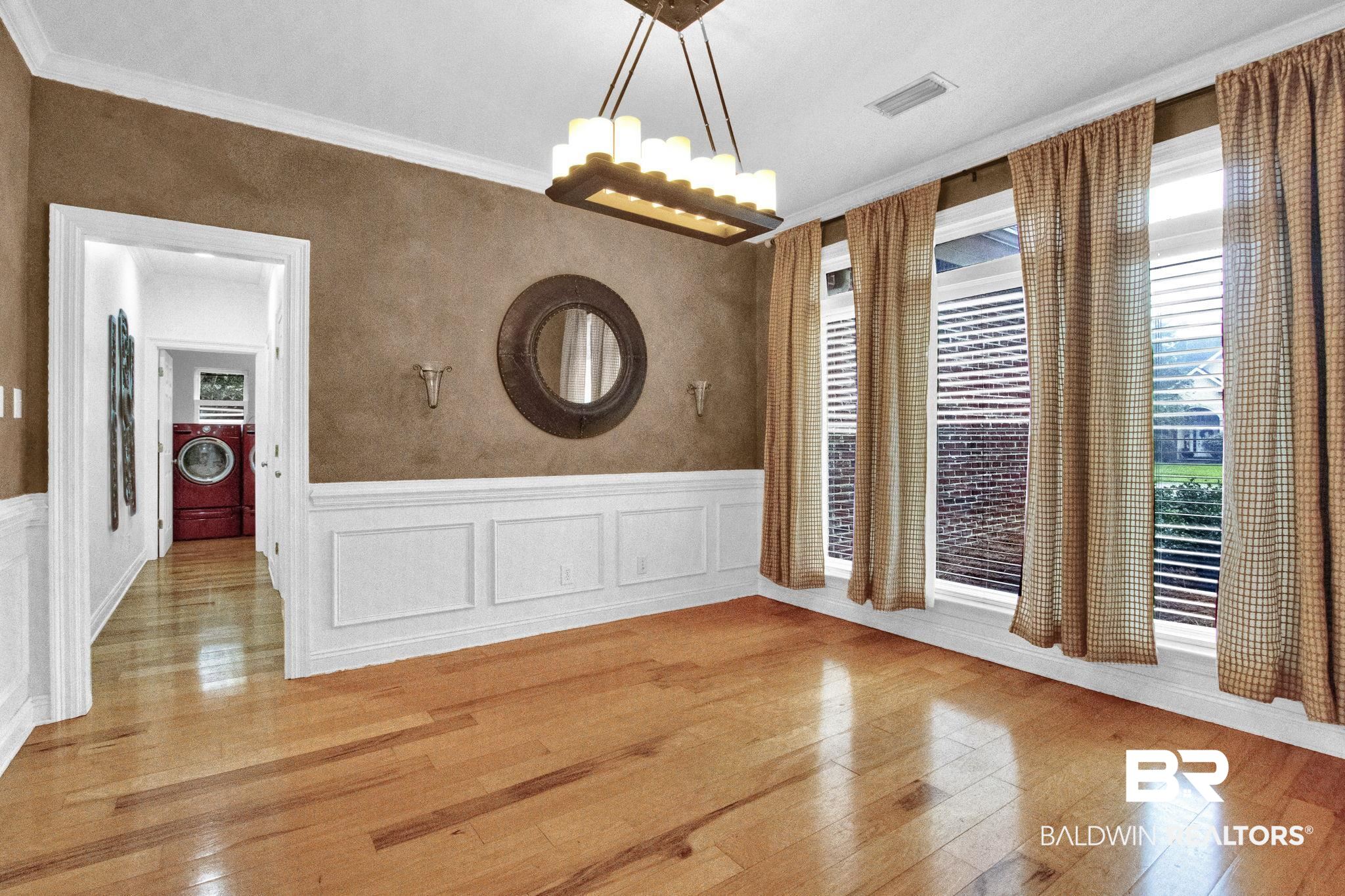 9002 Parliament Circle Daphne, AL 36526 - Photo 11 of 73 hardwood floors and crown molding, wainscoting.