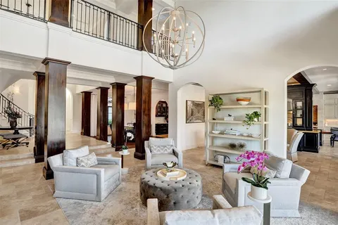 a view of a lake with couches chairs