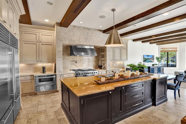 a view of a backyard with plants and a patio